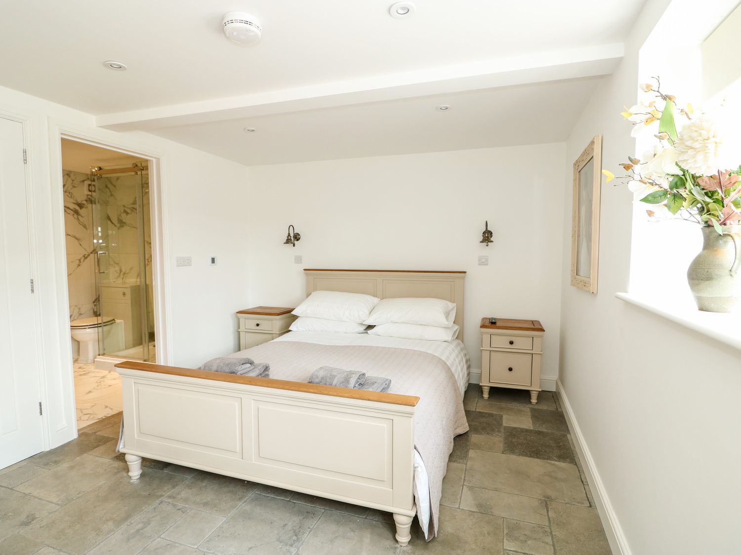 A bedroom at The Coach House with an en-suite