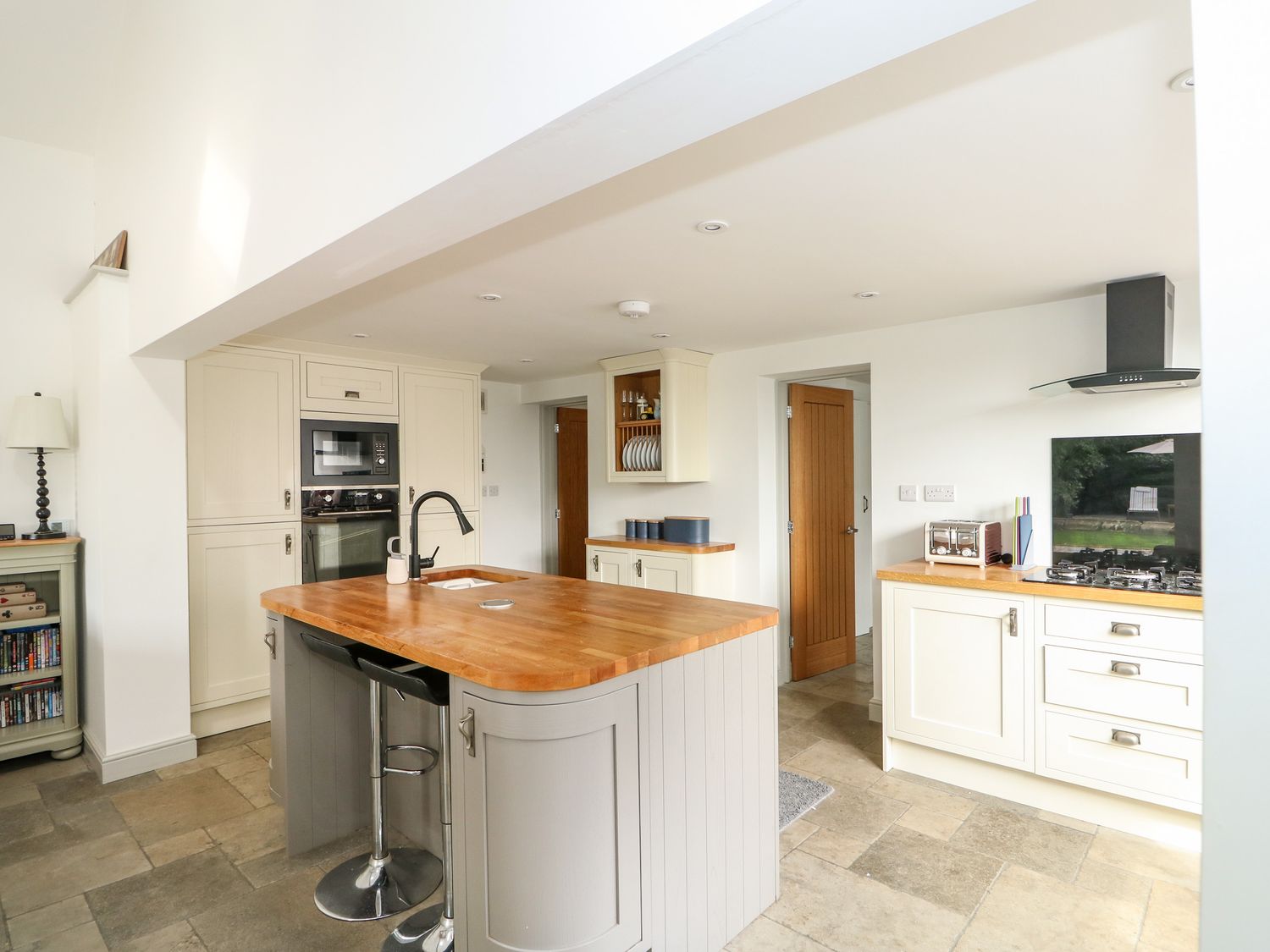 The Coach House's bright kitchen with island